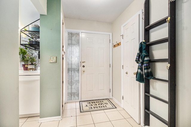 entryway featuring light tile patterned floors and baseboards