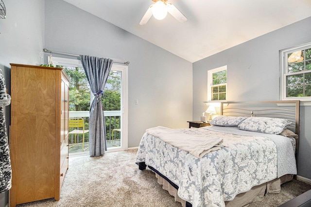 bedroom with lofted ceiling, multiple windows, carpet flooring, and access to exterior