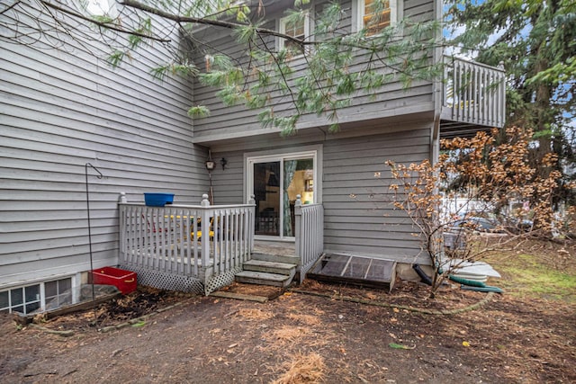 property entrance featuring a wooden deck