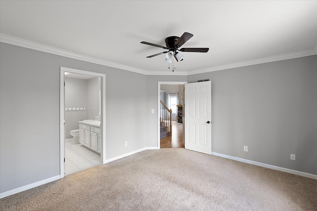 unfurnished bedroom featuring light carpet, baseboards, and ornamental molding