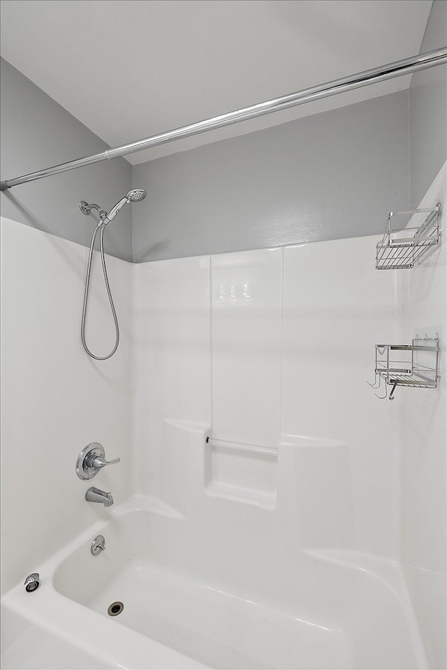 bathroom with shower / washtub combination