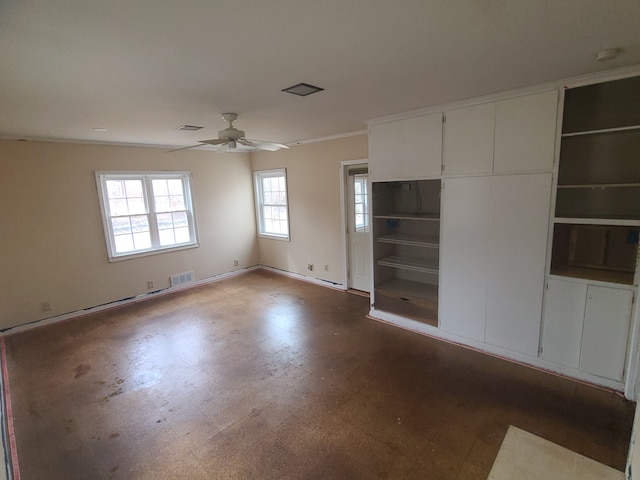 interior space with ceiling fan, crown molding, visible vents, and baseboards