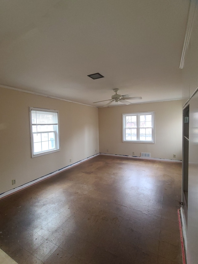 spare room featuring visible vents, ceiling fan, baseboards, and tile patterned floors