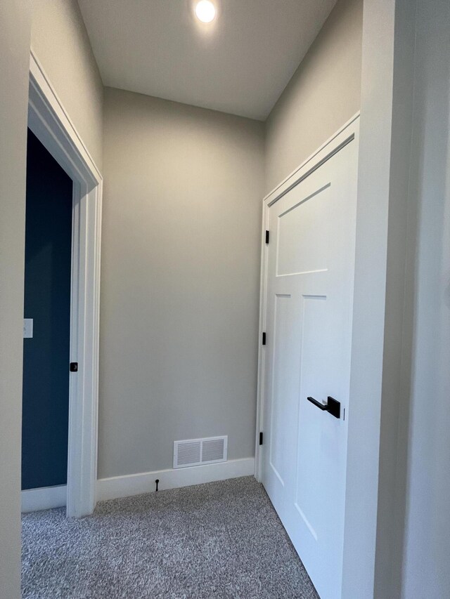 interior space featuring carpet, visible vents, and baseboards