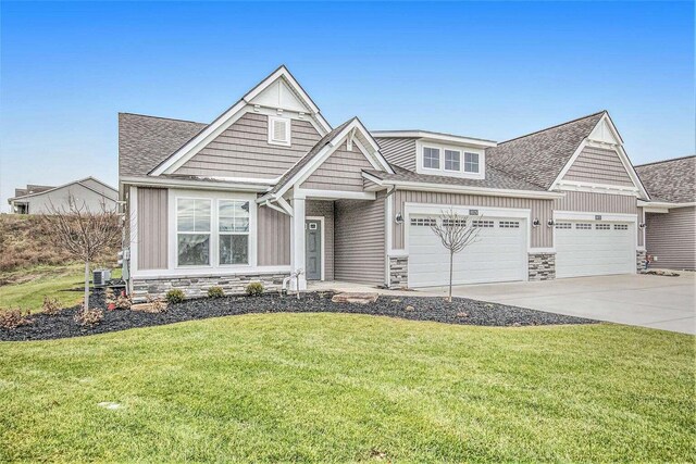 view of front of home with a garage, stone siding, a front lawn, and concrete driveway