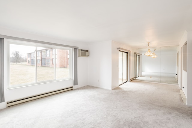 spare room featuring a baseboard radiator, light colored carpet, baseboards, a wall mounted air conditioner, and an inviting chandelier