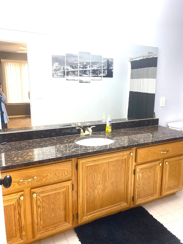 full bath with tile patterned floors and vanity