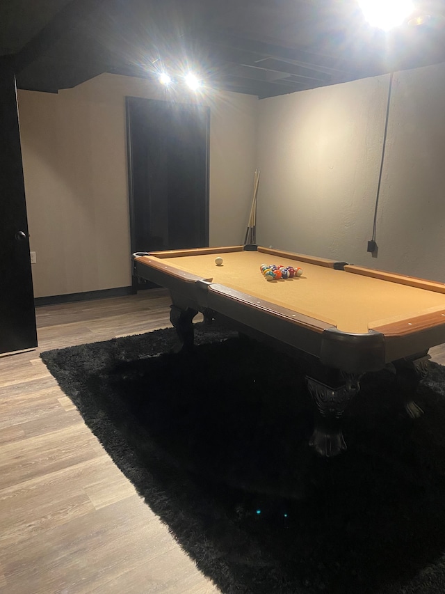 playroom with pool table and light wood-style flooring