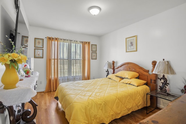 bedroom with wood finished floors