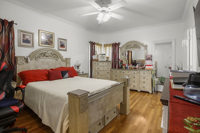 bedroom featuring crown molding, light wood-type flooring, and ceiling fan