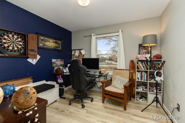 home office with wood finished floors and baseboards