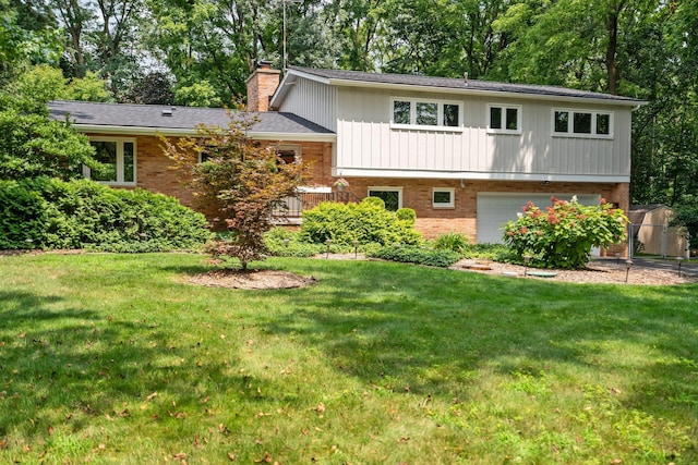 view of front facade featuring a garage, brick siding, a chimney, and a front yard