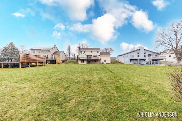 view of yard with a wooden deck