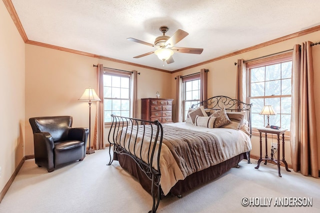 bedroom with light colored carpet, crown molding, and a textured ceiling