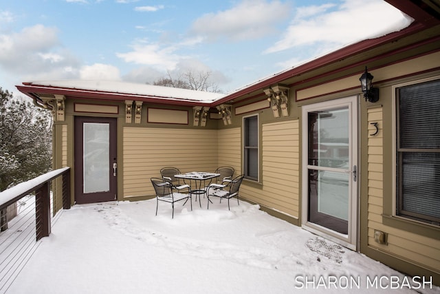 view of snow covered deck