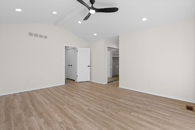 unfurnished room featuring light wood finished floors, visible vents, vaulted ceiling with beams, and a ceiling fan