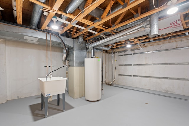 unfinished below grade area featuring a sink and water heater