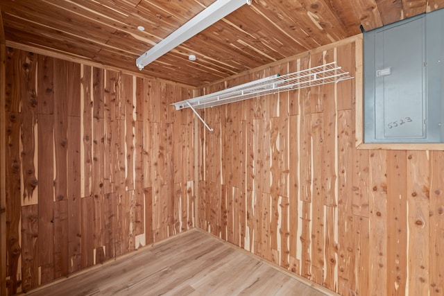 spacious closet with electric panel and wood finished floors