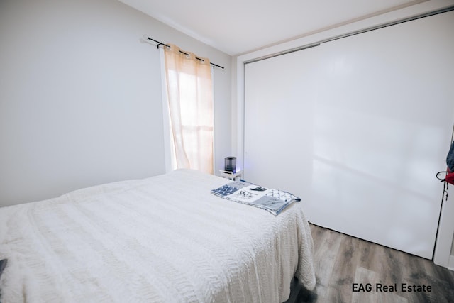 bedroom featuring wood finished floors