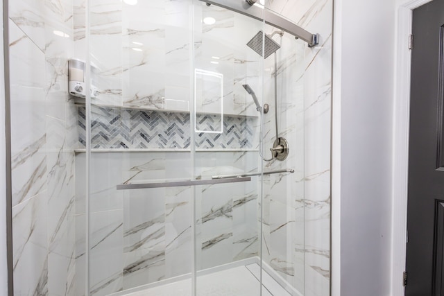 bathroom with a marble finish shower