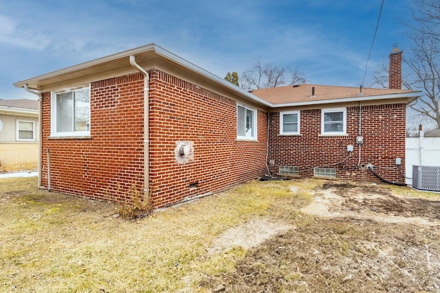 view of side of home featuring brick siding