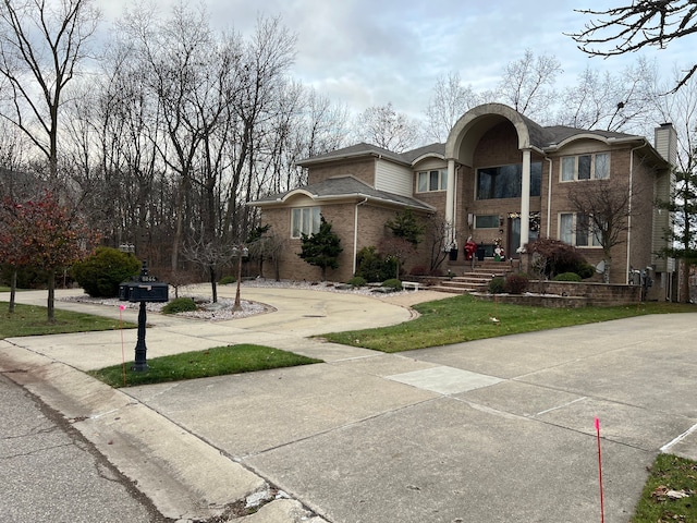 view of front of home featuring brick siding