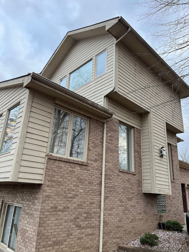 view of home's exterior with brick siding