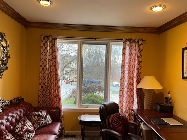 carpeted office space featuring visible vents and crown molding