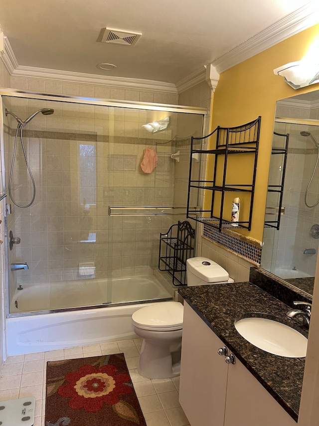 full bathroom with ornamental molding, visible vents, combined bath / shower with glass door, and tile patterned floors