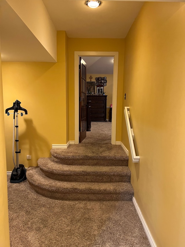 staircase with carpet and baseboards