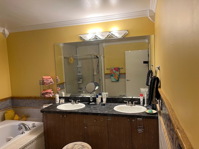 full bath featuring ornamental molding, a stall shower, a garden tub, and a sink