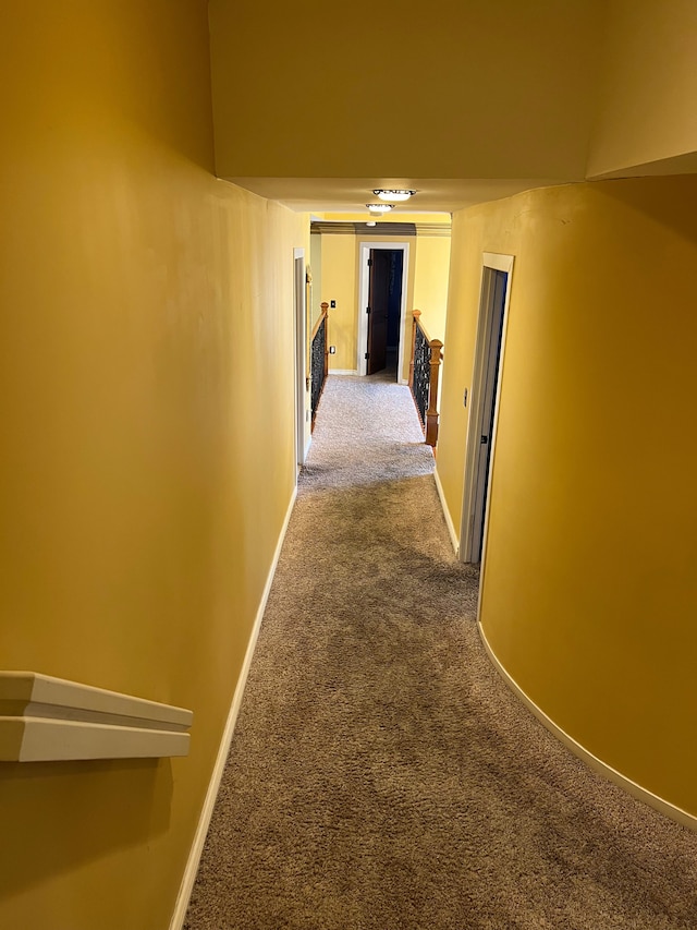 hall with carpet and baseboards