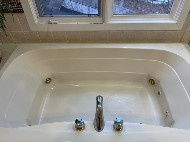 bathroom with a jetted tub