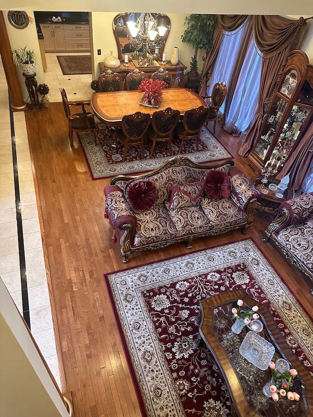 living area with a chandelier and hardwood / wood-style floors