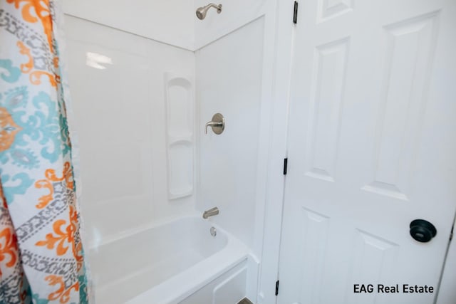 bathroom featuring shower / tub combo with curtain