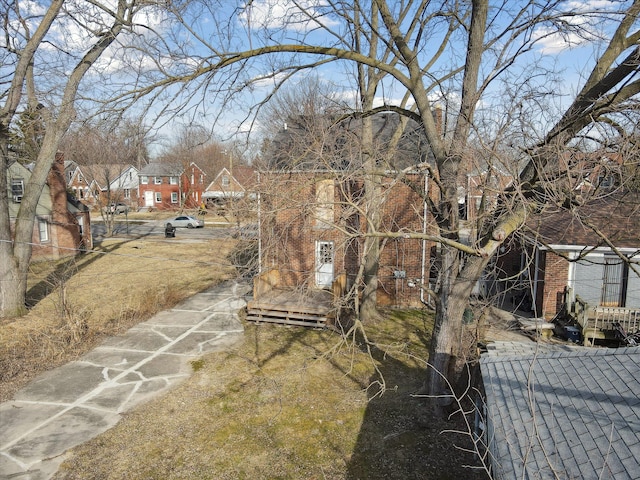 view of yard featuring fence and a residential view