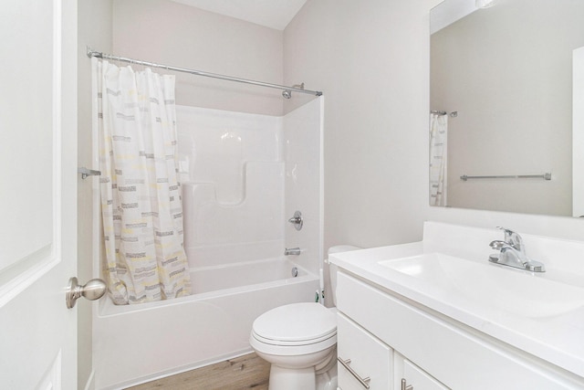 bathroom with vanity, shower / bath combo, wood finished floors, and toilet