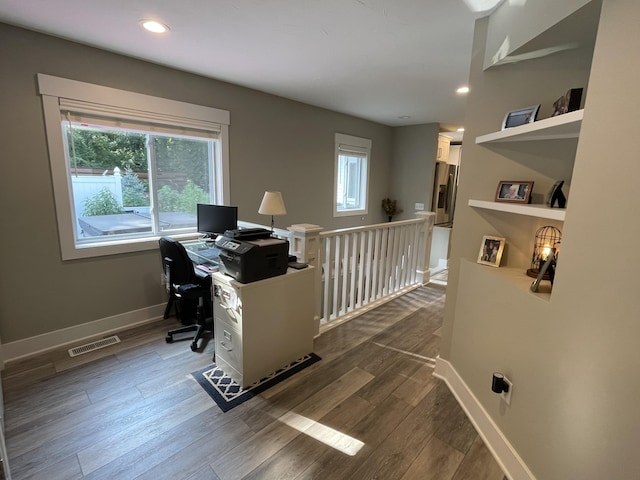 home office featuring dark wood-style floors, recessed lighting, visible vents, and baseboards