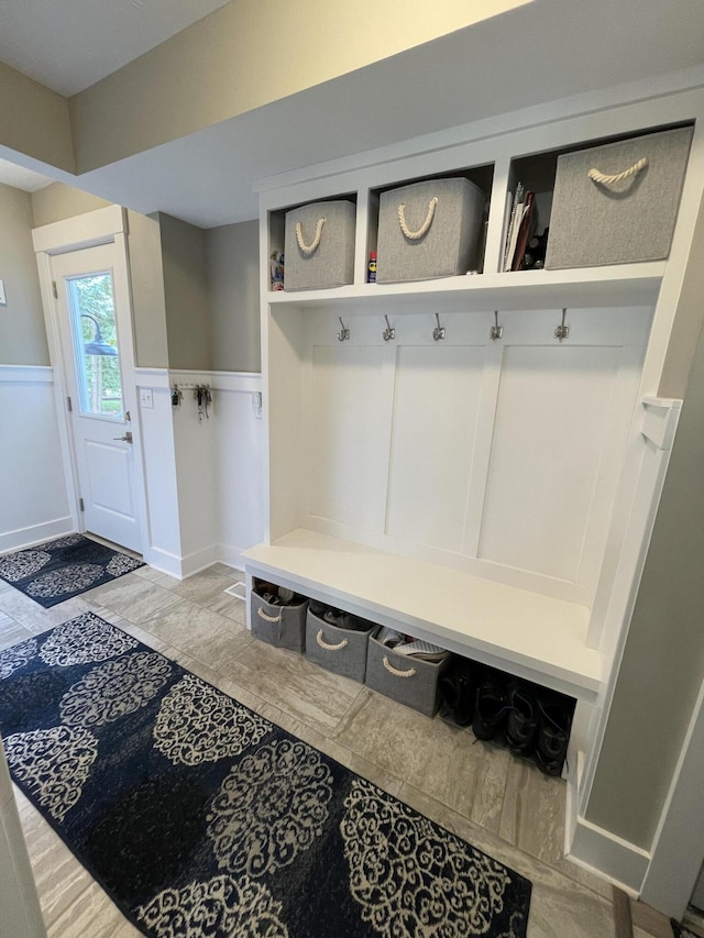 mudroom featuring wainscoting