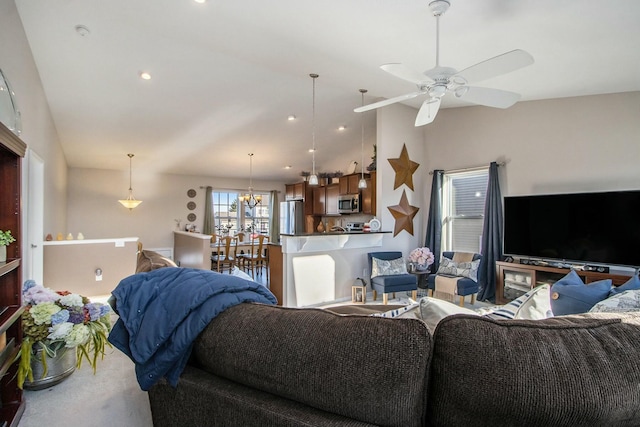 living area featuring recessed lighting, carpet, vaulted ceiling, and ceiling fan with notable chandelier