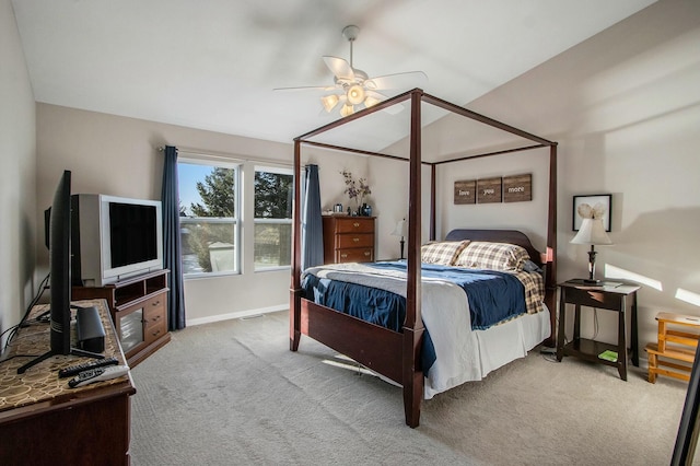 bedroom featuring carpet, visible vents, a ceiling fan, vaulted ceiling, and baseboards