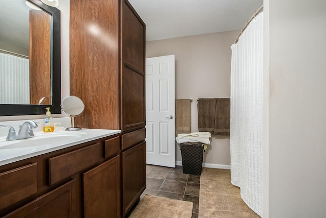 full bath with tile patterned floors and vanity