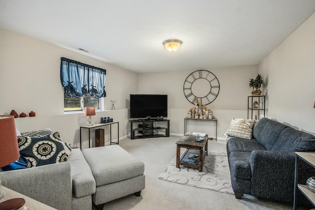 living room featuring carpet and baseboards