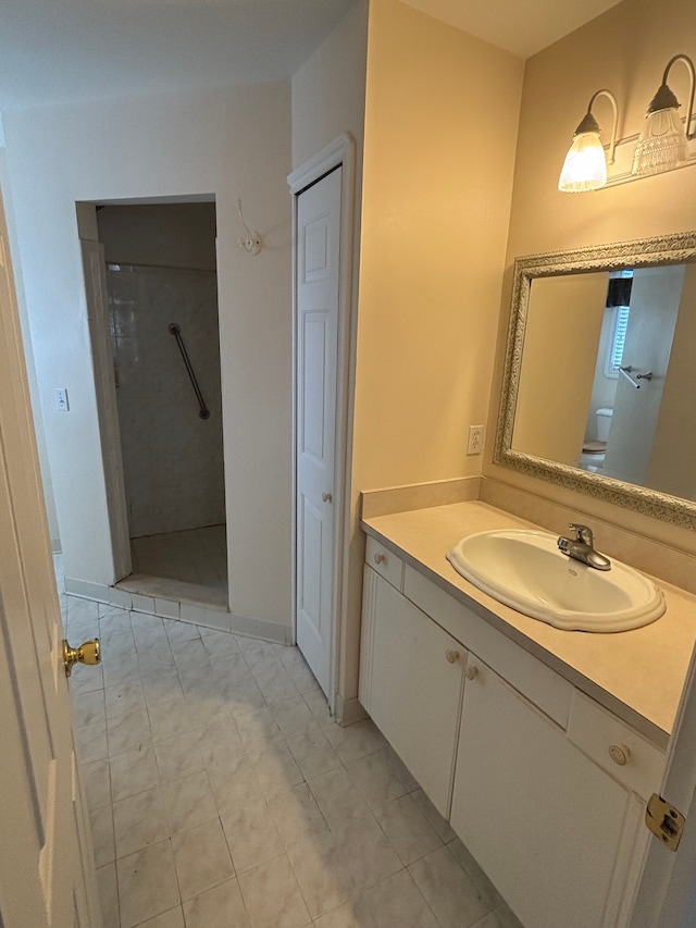 full bath featuring vanity, toilet, and a walk in shower