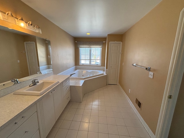 full bathroom featuring visible vents, a jetted tub, baseboards, tile patterned floors, and vanity