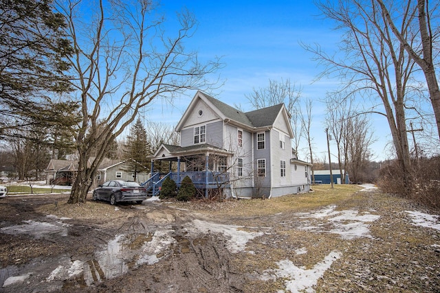 view of property exterior with a porch