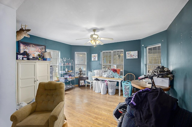 interior space with ceiling fan and wood finished floors