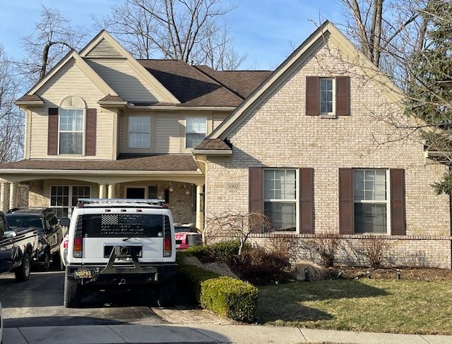 view of front of house with brick siding