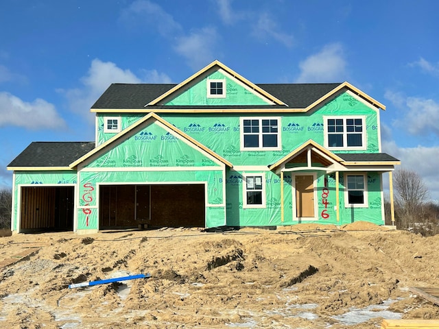 property under construction with an attached garage