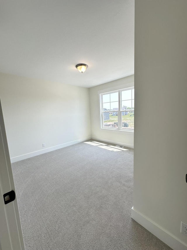 1846 Round Barn Dr, Hudsonville, MI 49426 - carpeted empty room featuring baseboards